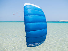 Load image into Gallery viewer, Blue kite labeled 'IGNITION' over clear water with a blue sky. IGNITION V3 - Trainer Kite ozone kids first kite portugal