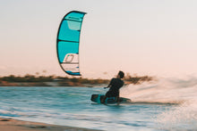 Load image into Gallery viewer, Person KITESURFING owith a colorful Ozone Edge VT