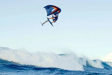 Load image into Gallery viewer, Person kite surfing on a wave with a clear sky ozone Flow v2 branding on a wingfoil portugal
