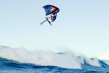 Load image into Gallery viewer, Person kite surfing on a wave with a clear sky ozone Flow v2 branding on a wingfoil portugal
